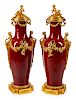 A Monumental Pair of Gilt-Bronze-Mounted Sang de Bouef Porcelain Vases and Covers