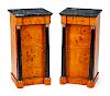 A Pair of Empire Style Parcel-Gilt and Ebonized Birch Nightstands