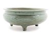 A Large Longquan Celadon Glazed Porcelain Tripod Incense Burner
Diam 9 3/4 in., 25 cm. 