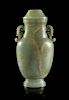 A Large Celadon Jade Covered Vase
Height 10 3/4 in., 28 cm. 