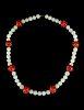 A White Jade and Agate Beaded Necklace
Length 13 in., 33 cm. 