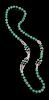 An Apple Green Quartz Beaded Necklace
Interior: diam 2 1/4 in., 6 cm. 