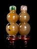 A Carved Agate Double Gourd-Form Double Snuff Bottle
Height 2 1/4 in., 6 cm. 