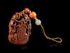 A Gold Splashed Glass Gourd-Form Pendant
Width 2 1/4 in., 6 cm. 