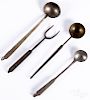 Three wrought iron tasting ladles and a fork