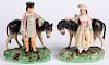 Pair of Staffordshire figures of a boy and girl