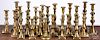 Large collection of brass candlesticks