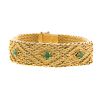 A Ladies Wide 18K Woven Bracelet with Emeralds