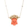 A Ladies Carved Coral Pendant with Diamonds in 14K