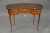 Louis XVI style kingwood and fruitwood petite bureau kidney form with brass trim. ht. 29 in., top: 18 1/2" x 39".