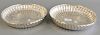 Pair of Irish silver circular dishes, 18th/19th century, circular form with fluting and centering an engraved crest. ht. 2 in., dia....