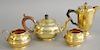 Four piece English silver lot with three piece tea set plus small tea pot, all with gold wash, 23.3 t.oz