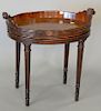 George III mahogany tray, oval, on later stand with scroll handles. ht. 20 in., top: 14" x 20".
