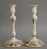 Pair of copper mounted staffordshire enamel candlesticks with white ground, each with five enameled landscape scene around base, cir...