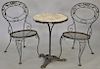 Three piece outdoor ice cream table having round marble top, iron base and two chairs. dia. 20 in., ht. 29 in.