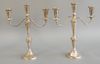 Pair of sterling silver convertible three light candelabra having scrolling candle arms, weighted. ht. 13 1/2 in., wd. 11 in.