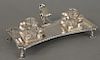 George III silver inkstand, London, 1771, snuffer's stand set with two glass inkwells. ht. 2 1/2 in., wd. 7 1/4 in., lg. 7 1/4 in. 7...