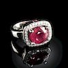 A 14K WHITE GOLD, RUBY, AND DIAMOND HALO LADY'S RING,