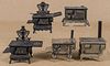 Five cast iron and nickel toy stoves, to include