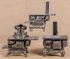 Three cast iron and nickel toy stoves, to include