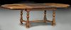 Antique style oak dining table with two leaves