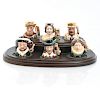 6 TINY ROYAL DOULTON CHARACTER JUGS AND STAND