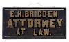 Wooden Mispelled Attorney At Law Sign