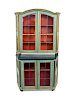 An Italian Painted and Parcel Gilt Two-Part Display Cabinet
Height 78 x width 46 x depth 21 inches.