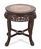 A Chinese Carved Hardwood Table with Inset Marble Top 
Height 19 x diameter 17 1/4 inches.