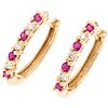 A ruby and diamond 14K yellow gold ring pair of earrings. 