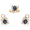 A sapphire and diamond 18K yellow gold ring pair of earrings set. 