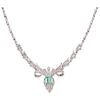 An emerald and diamond palladium silver necklace.