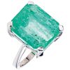 An emerald 14K white gold ring.