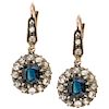 A sapphire and diamond 18K pink gold and silver pair of earrings.