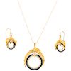 An onix, diamond and ruby 18K yellow gold necklace, pendant and pair of earrigs. 