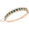 An emerald and diamond 10K pink gold bracelet.  
