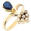 A sapphire and diamond 14K yellow gold ring. 
