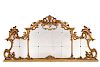 A Continental Rococo style giltwood mirror