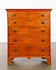 A Chippendale tiger maple tall chest of drawers