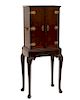 A  George II walnut collector s cabinet on stand