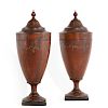A pair of George III style mahogany knife urns