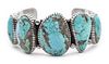 A Navajo Turquoise Bracelet, Edison Begay Length 5 7/8 x opening 1 2/8 x width 1 3/8 inches.
