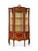 A Louis XV Style Gilt Bronze Mounted Marquetry Decorated Mahogany Vitrine