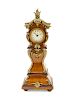 A Diminutive Louis XV Style Gilt Metal Mounted Case Clock
