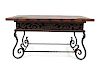 A Spanish Baroque Style Iron and Walnut Low Table
Height 20 1/2 x width 40 x depth 26 inches.