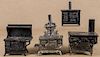 Four cast iron and nickel toys stoves, to include