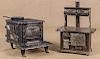 Two cast iron toy stoves, to include one Kenton