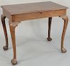 Chippendale mahogany table having lift top and ball and claw feet. height 29 inches, top: 20 1/2" x 35".