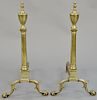 Pair of Chippendale brass andirons, with urn tops and turned shafts, set on ball and claw feet. height 25 3/8 inches.