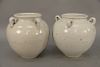 Pair of white glazed monochrome stoneware jars, China 19th century (possibly older), with four loop handles in Song style, unmarked. height 10 inches.